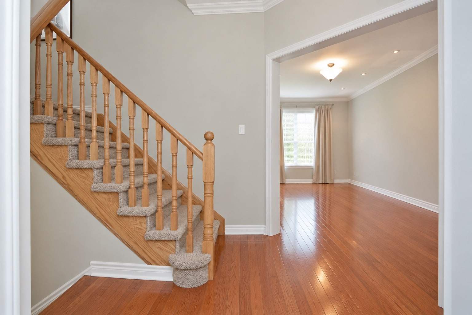 Empty_Foyer_with_Oak_Sta.jpg